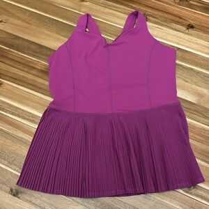 Pink peplum lululemon tank top. Buit in bra. Size 8